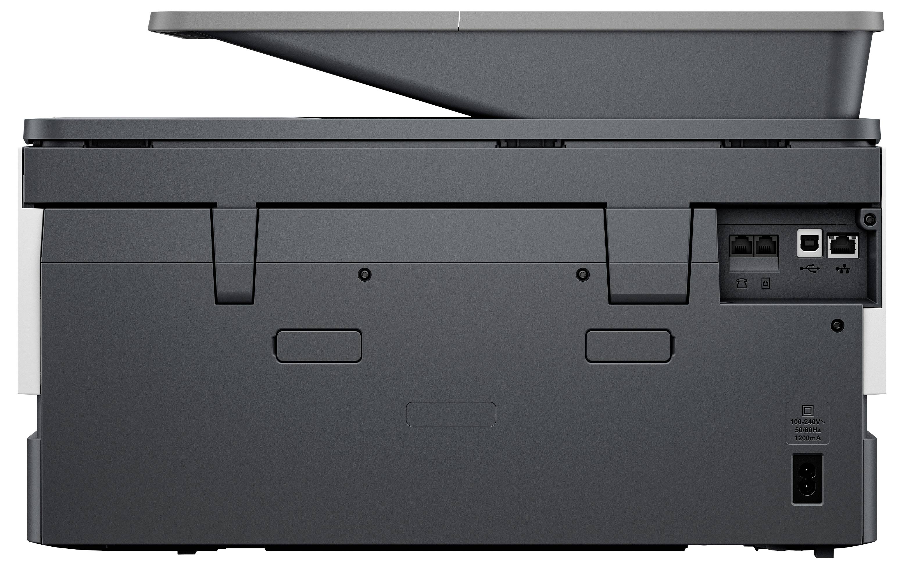 Rear view of a gray multifunction printer/copier showing paper trays, connection ports, and power socket.
