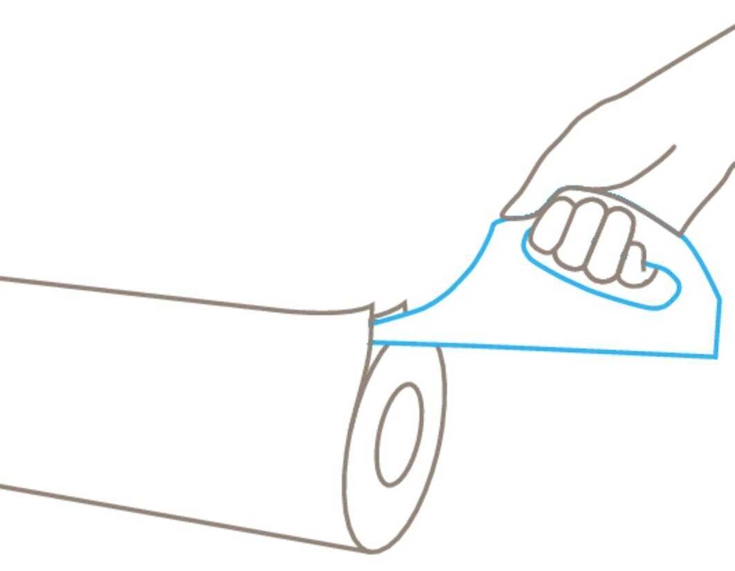 'A hand tears off a piece of kitchen roll using a perforated edge.'