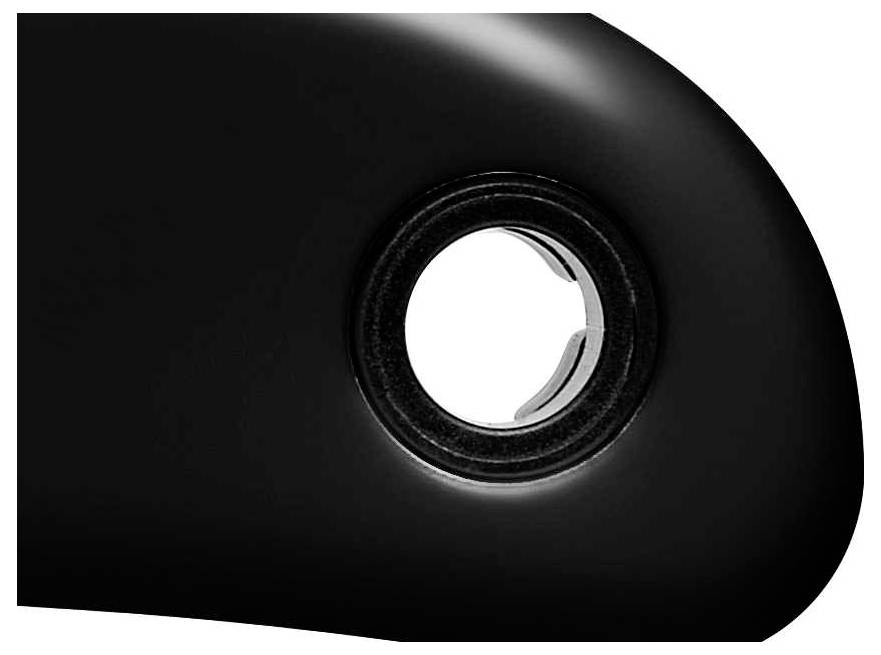 A black, curved object with a circular hole in its centre; metal edges are visible along the inner rim of the hole.