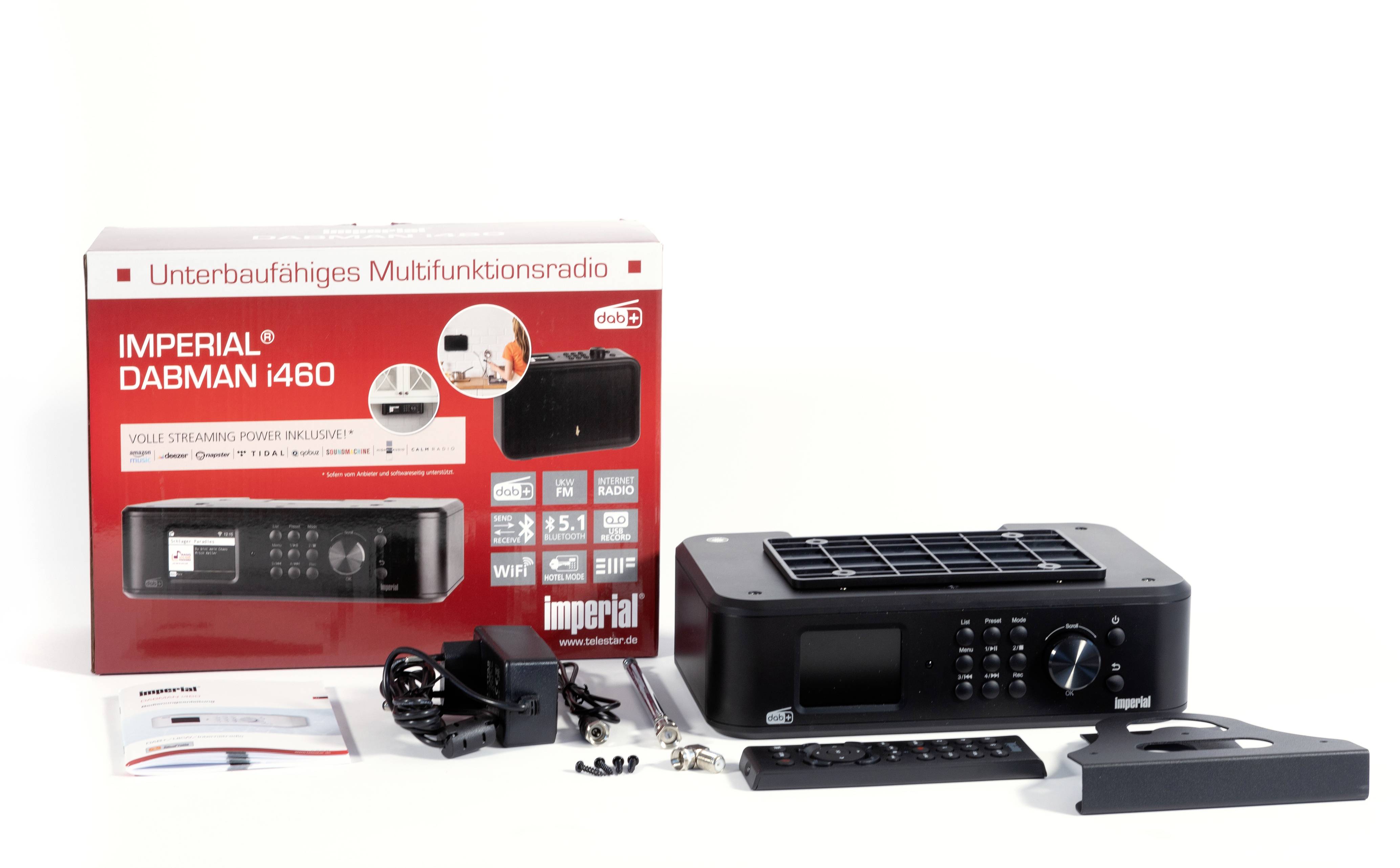 'Imperial Dabman i460' Multifunction Radio with Accessories: Power Supply, Remote Control, Mounting Hardware and Packaging Box in the Background.