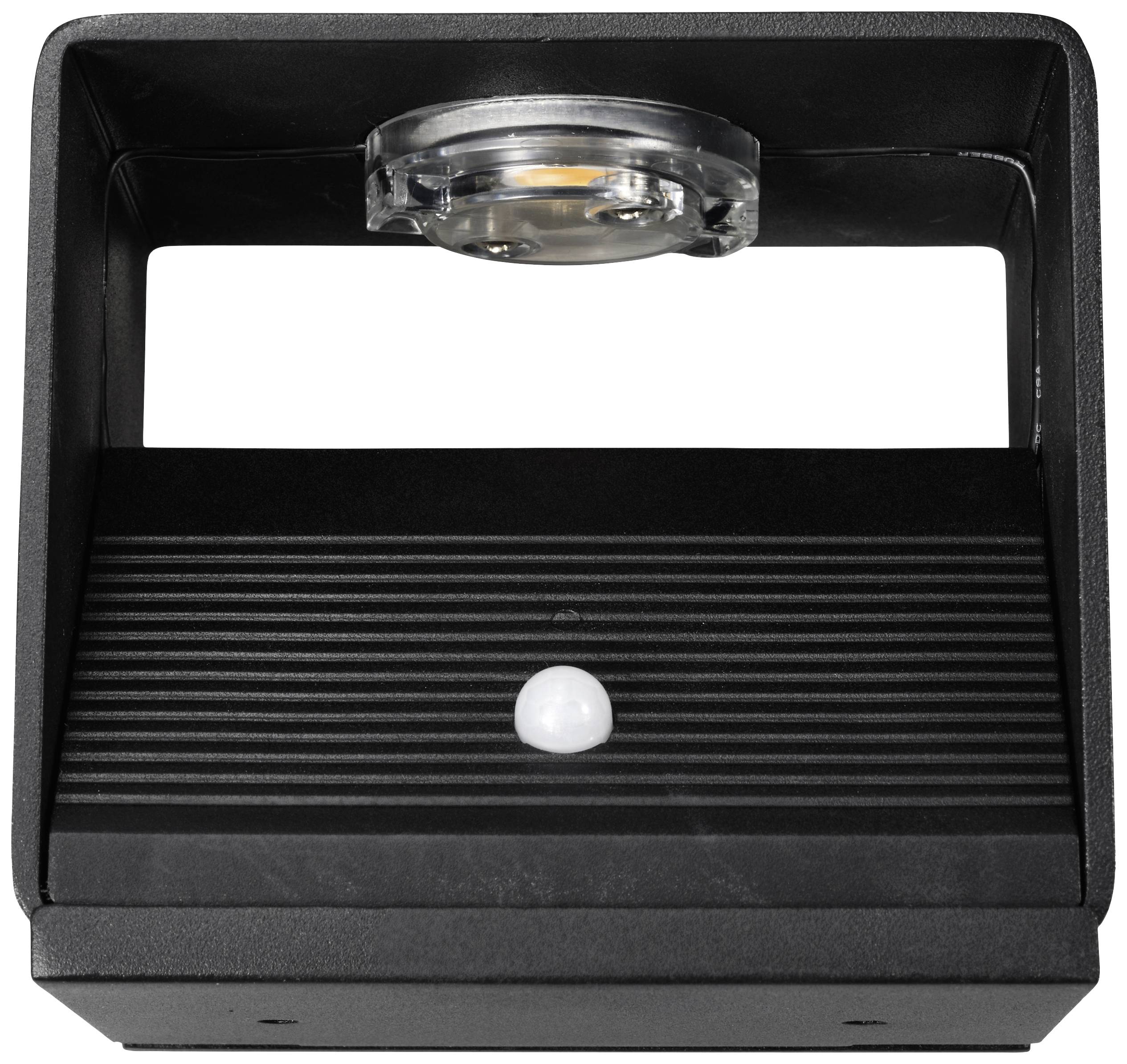 Black rectangular device with a ribbed pattern and a small round lens in the centre, likely a motion sensor or light.