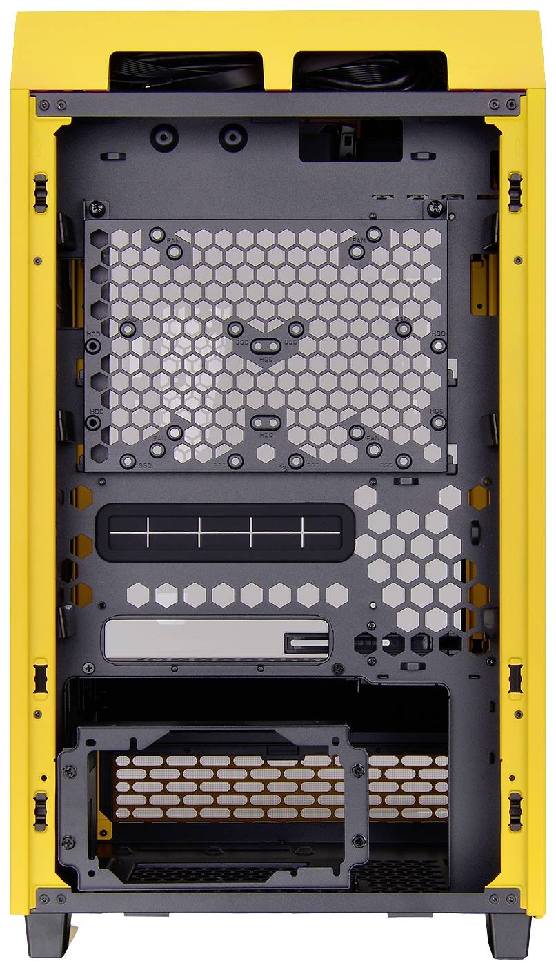 Yellow computer case from the inside, showing empty mounting spaces for components such as motherboard, power supply and fans.