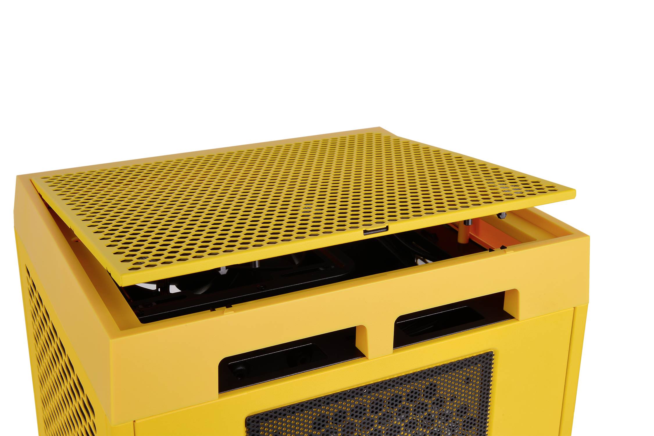 Yellow, rectangular device with a removable, perforated lid. It reveals technical components inside.