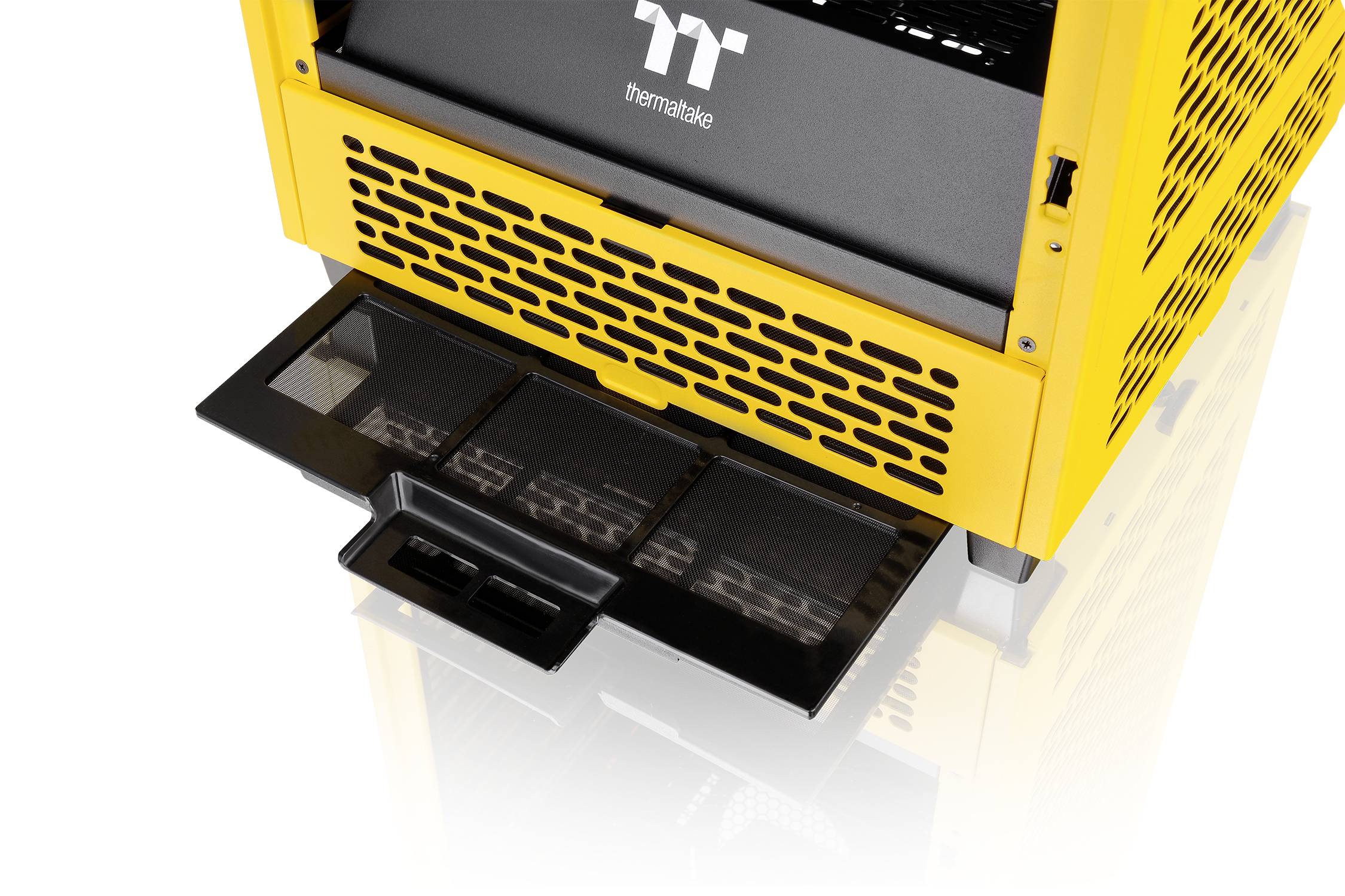 A yellow computer case with a removable dust filter on the underside and ventilation slots for improved airflow.