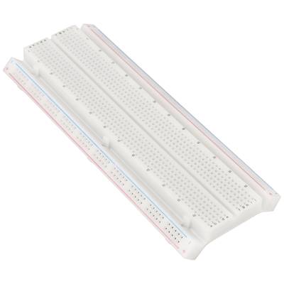 A white breadboard with blue and red lines, used for electronic prototyping.