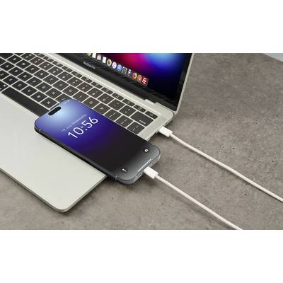A smartphone is charging via a cable connected to a laptop. The time '10:56' is displayed on the smartphone's screen.