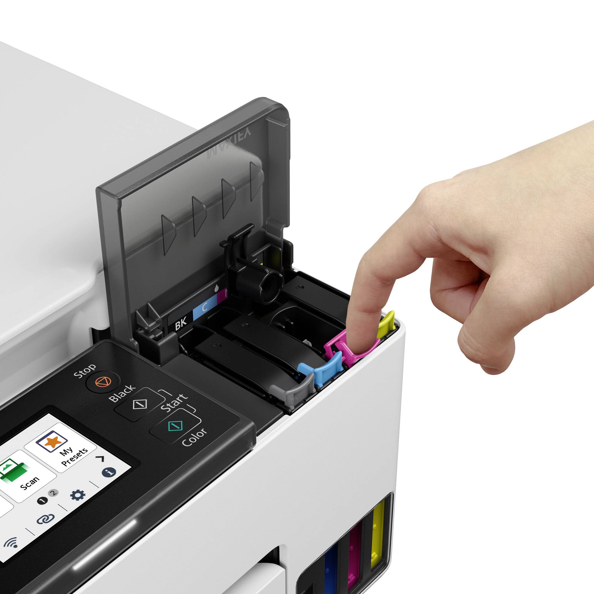 A hand is inserting a magenta printer cartridge into a printer with digital controls.