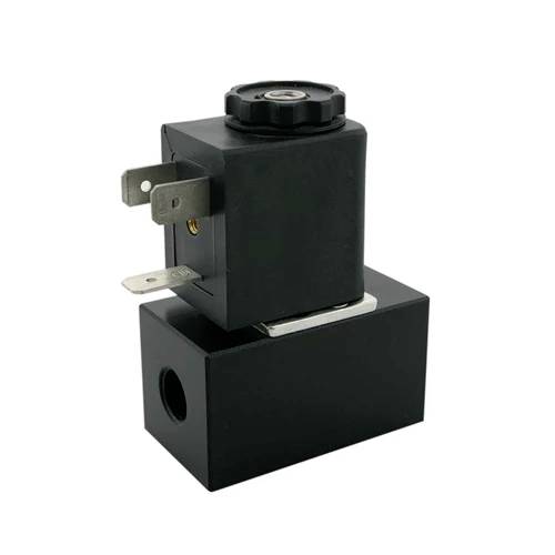 A black electromagnetic valve with metal connections and a round rotary knob on top. It has a rectangular base.