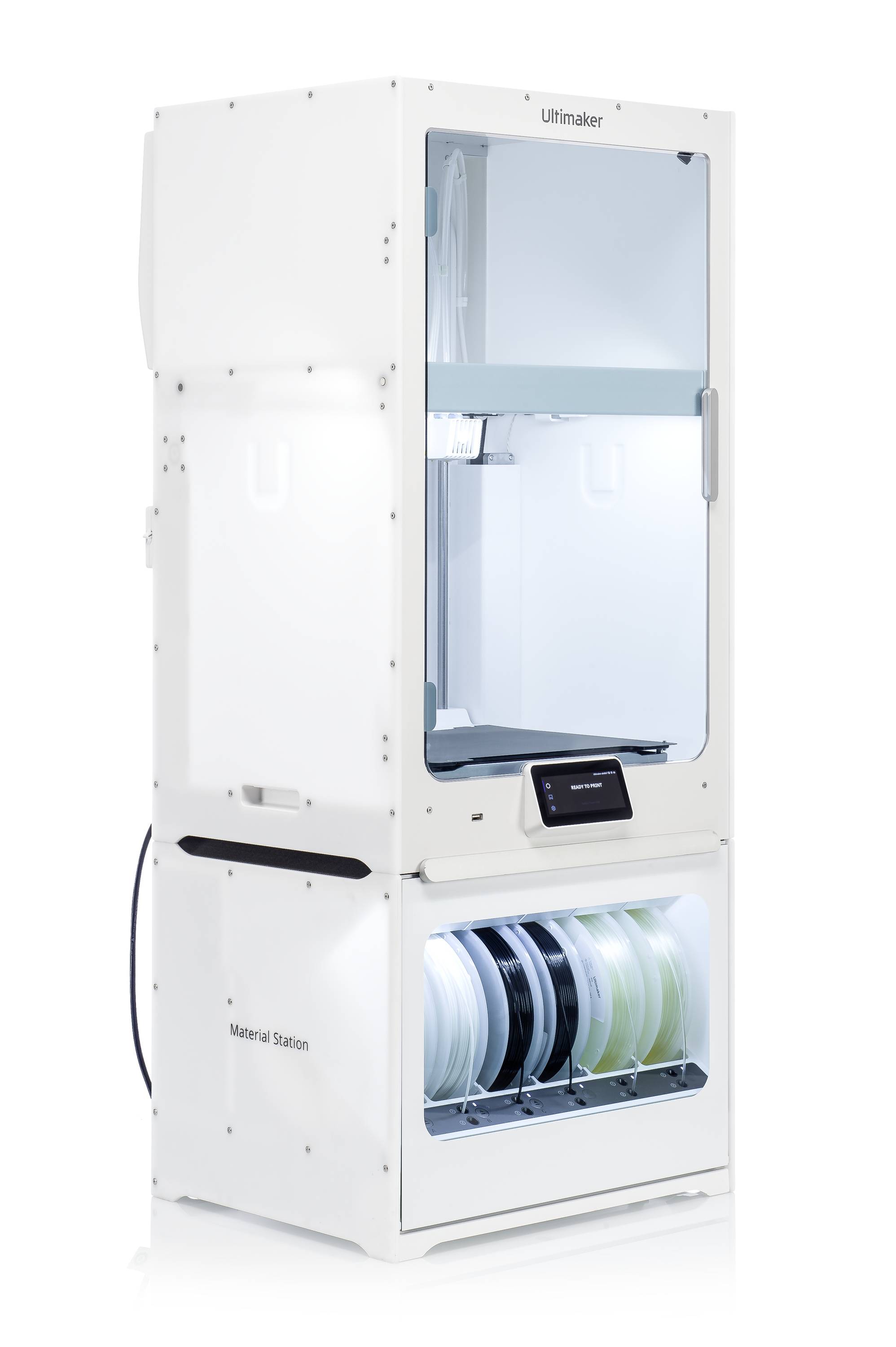 A white 3D printer station with multiple filament reels in the lower material station. Screen displays 'Ready'.