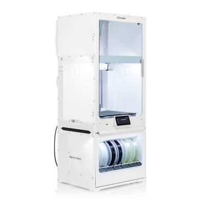 A white 3D printer station with multiple filament reels in the lower material station. Screen displays 'Ready'.