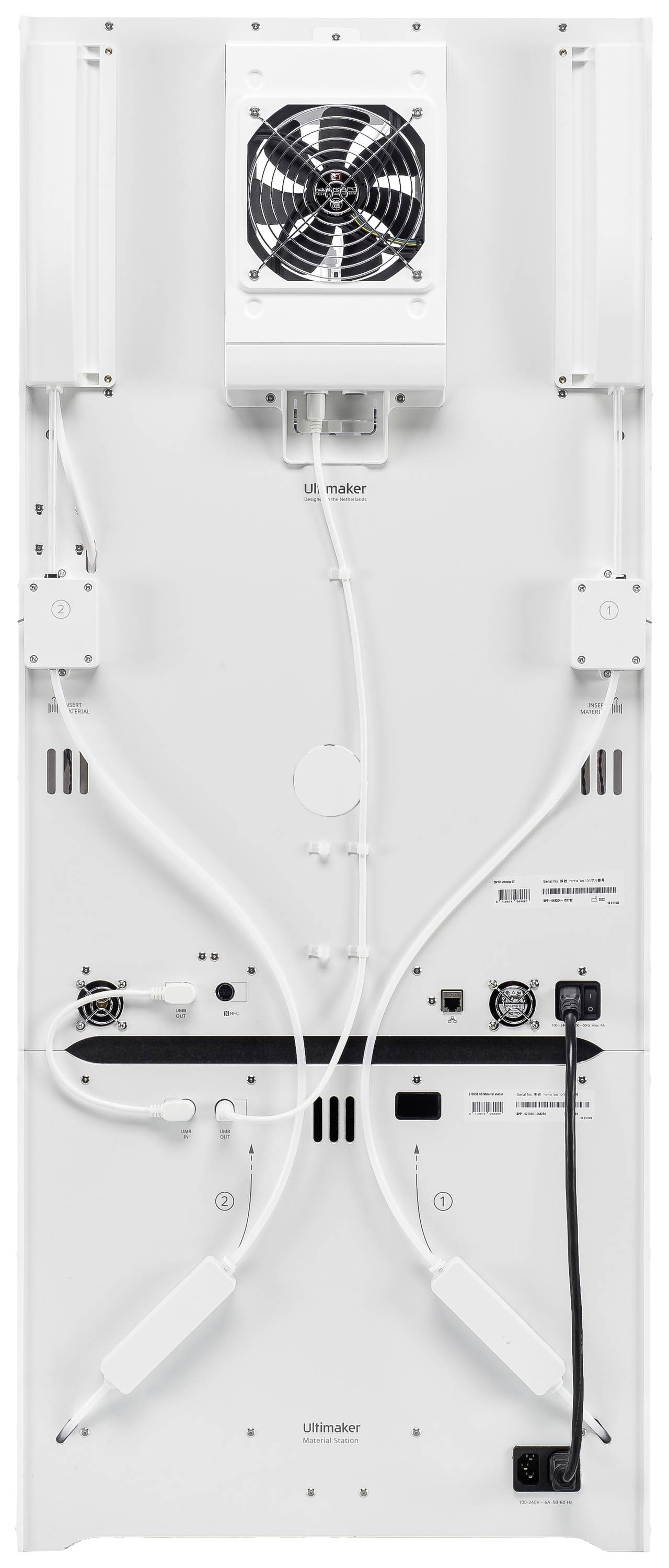 Rear view of a white household appliance with a fan at the top and cable connections at the bottom. Various power and data cables connected.