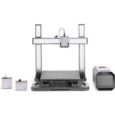 3D printer with a rectangular frame, typical print platform in the centre, and control box on the right. Two modules to the left of the platform.
