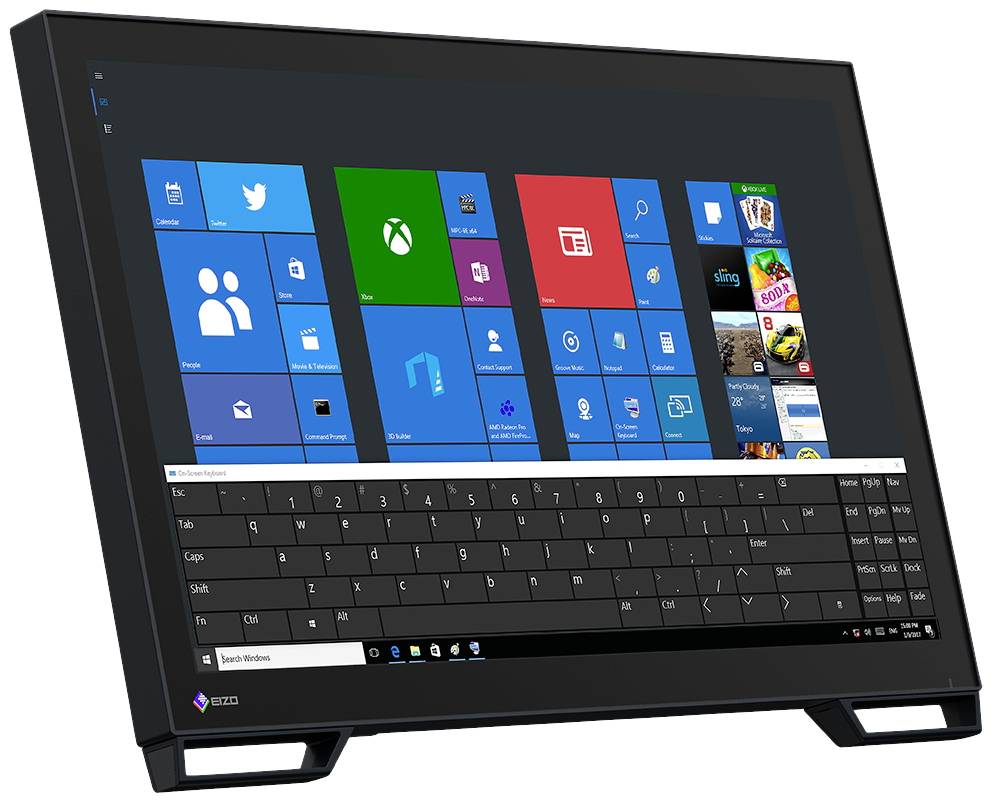 A black monitor displays the Windows desktop with multiple app icons and an on-screen keyboard at the bottom.