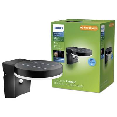 Philips solar-powered LED wall light shown beside its green product box, labeled 250 lumens and up to 4 nights of light on a single charge.