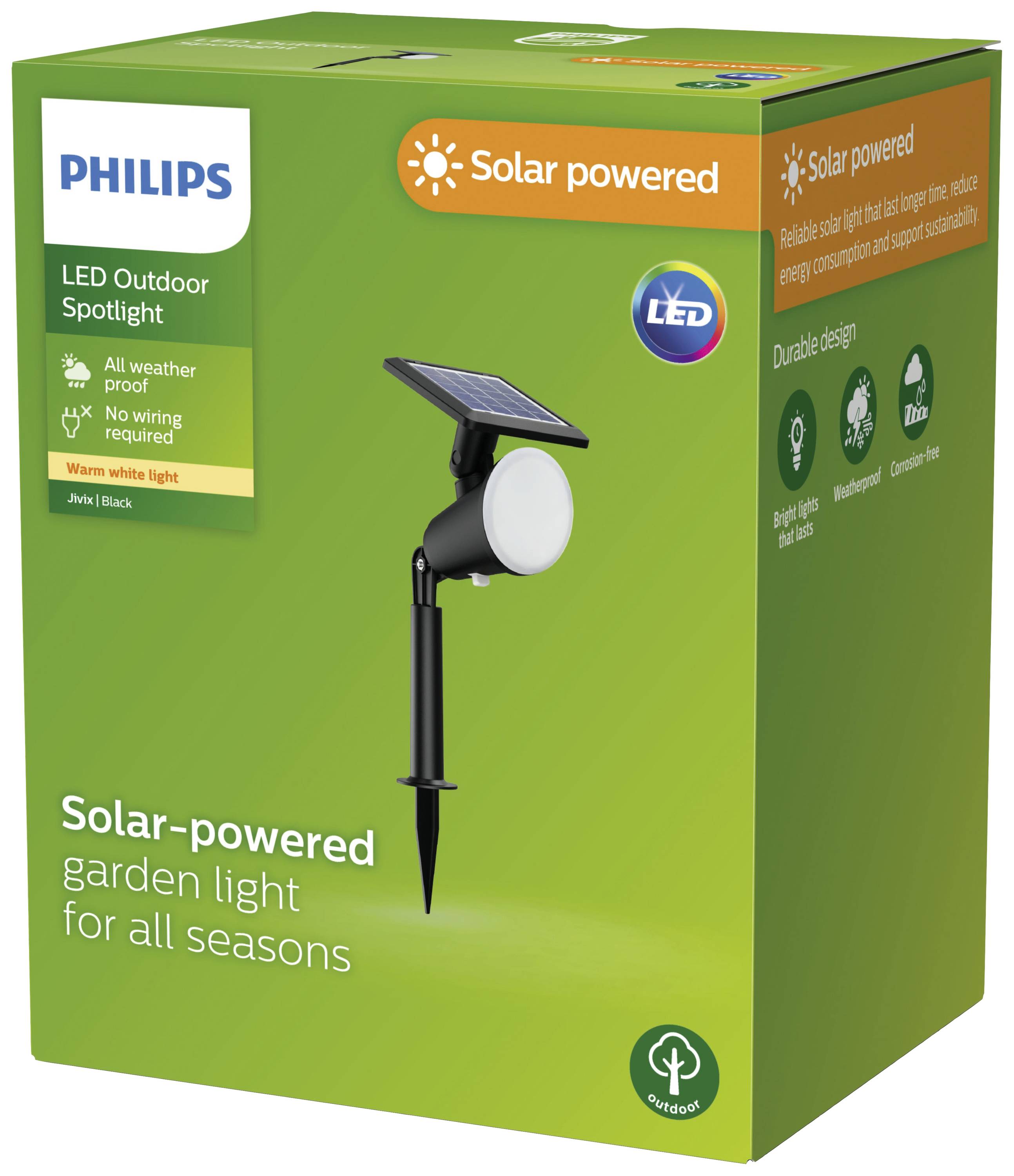 Green packaging of a Philips LED solar outdoor spotlight with ground spike. Labels: 'Solar powered', 'All weather proof', 'Warm white light'.