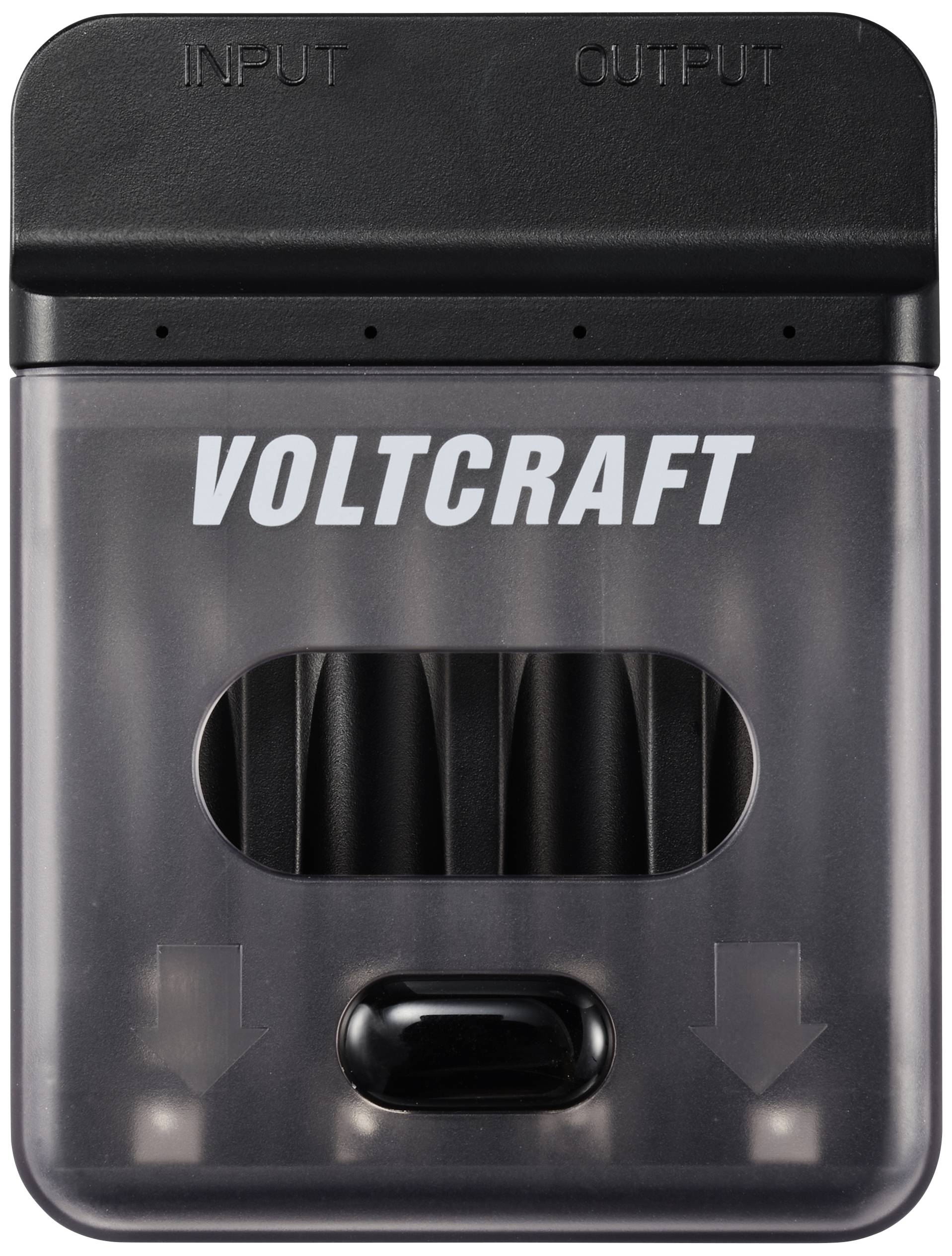 Voltcraft branded charger with a transparent casing designed to accommodate multiple batteries. 'Input' and 'Output' are displayed on the top of the device.