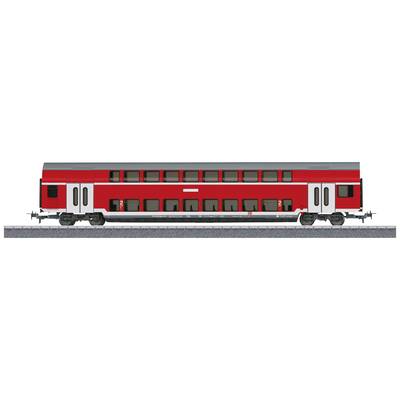 A red double-decker train carriage stands on a railway track. The carriage has black windows and white door areas.