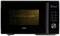 Black microwave with digital display showing 39:32. The illuminated interior compartment is visible through a grill on the left.