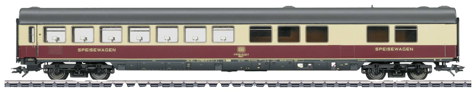 Model railway dining car with dark red and beige paintwork, windows with curtains, standing on a section of track.