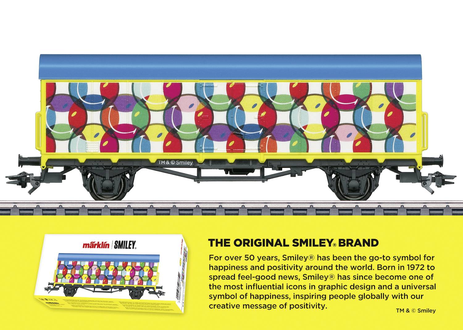 A colourful train carriage with smiley faces. The text suggests that the smiley has been a symbol of happiness and positivity for 50 years.