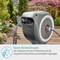 Garden hose reel on patio, hose connected. Text: 'No tangling thanks to RollControl and integrated hose guidance.'