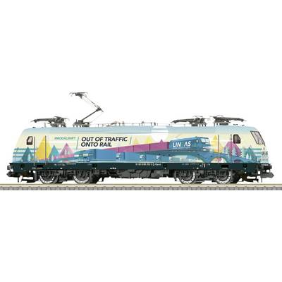 A modern electric locomotive with colourful landscape graphics, featuring a freight train and the text 'Out of Traffic Onto Rail'.