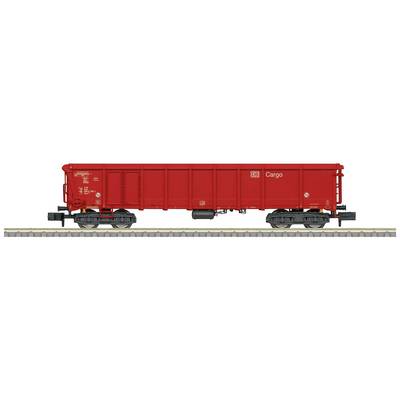 A red goods wagon is standing on a railway track. 'Cargo' is written on its side. The wagon has black wheels and is suitable for transporting goods.