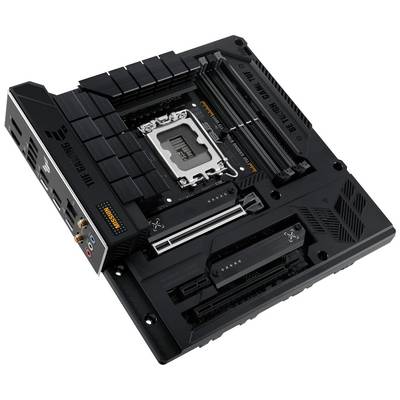 Black computer motherboard with CPU socket in the centre, surrounded by multiple expansion slots and connectors. 'TUF Gaming' marking.