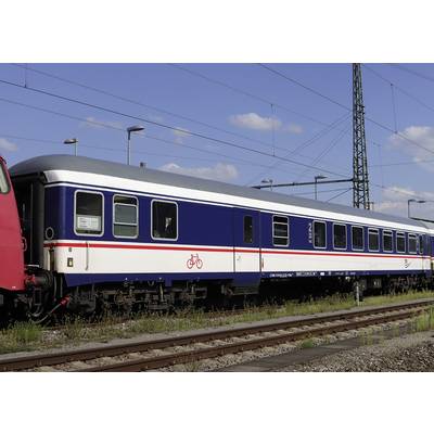 A blue train carriage with a bicycle symbol stands on a railway track. The sky is clear with a few clouds.