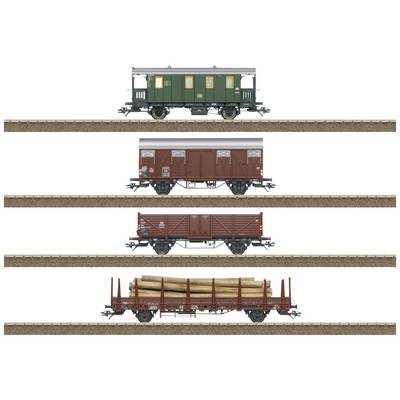 Four goods wagons on railway tracks. From top to bottom: passenger carriage, two covered goods wagons, open wagon loaded with timber logs.
