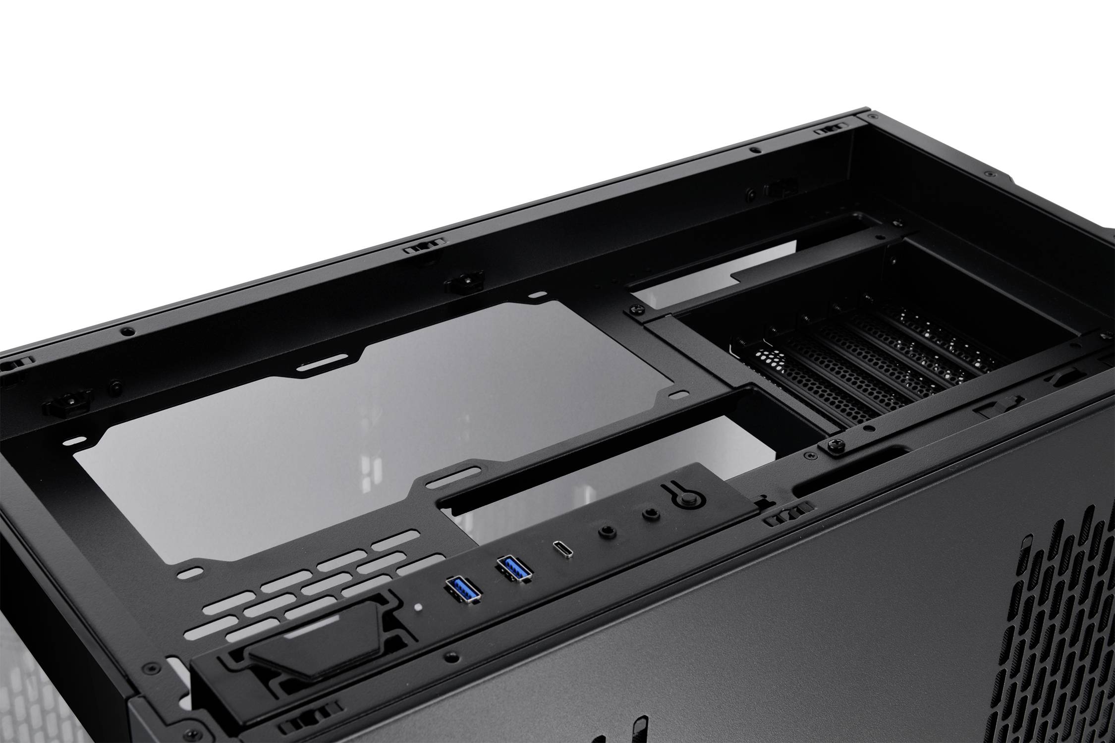 An opened computer case lid reveals a steel construction and ventilation slots; USB ports and power button are visible.