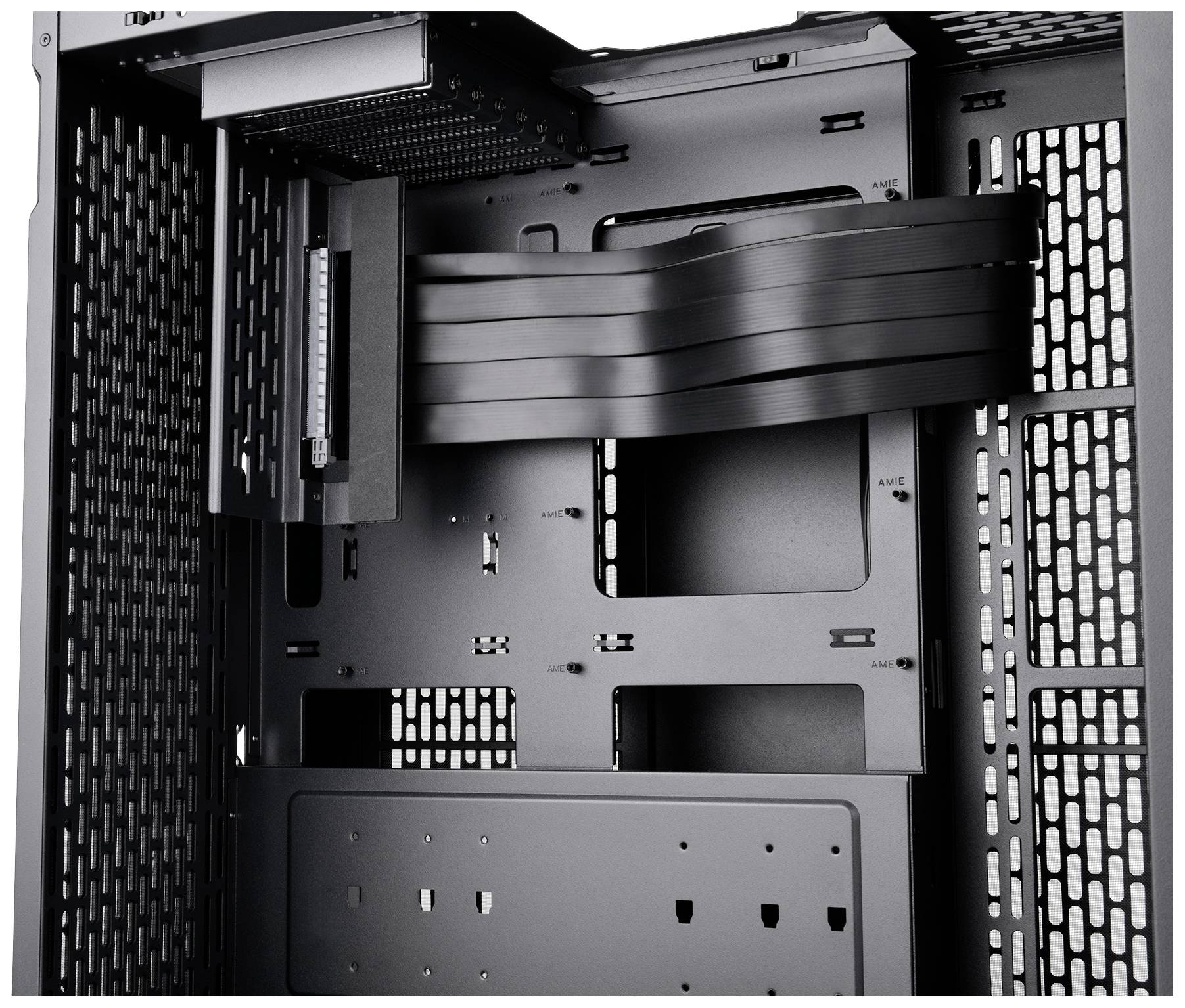 Black computer case interior, showing mounting brackets and ventilation slots, for cooling and component installation.