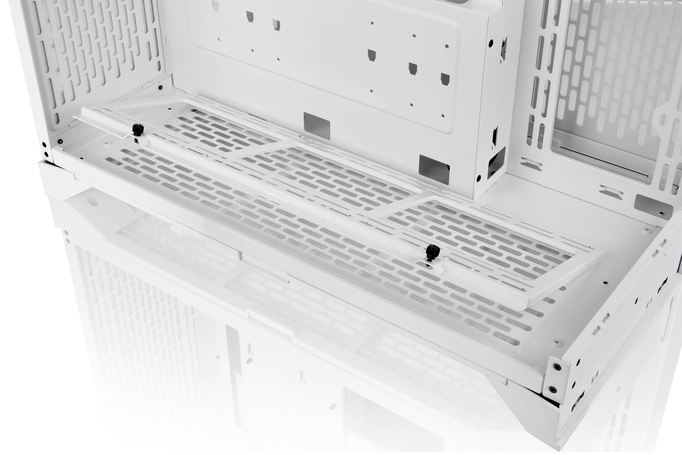 A vacant, white computer case interior with holes for air circulation and mounting points for components.