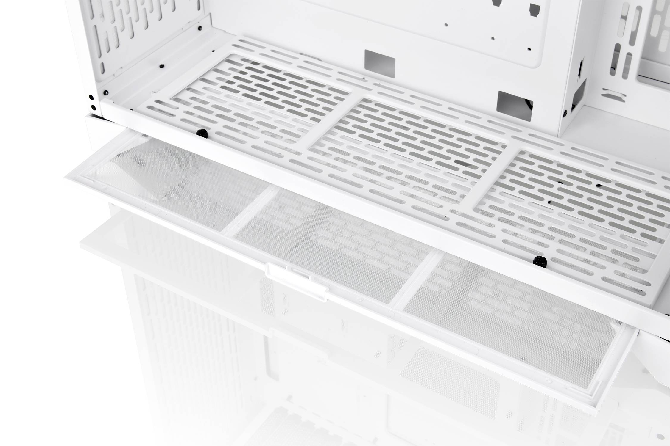 An open computer case with ventilation slots and a removable dust filter, revealing the internal structure for hardware installation.