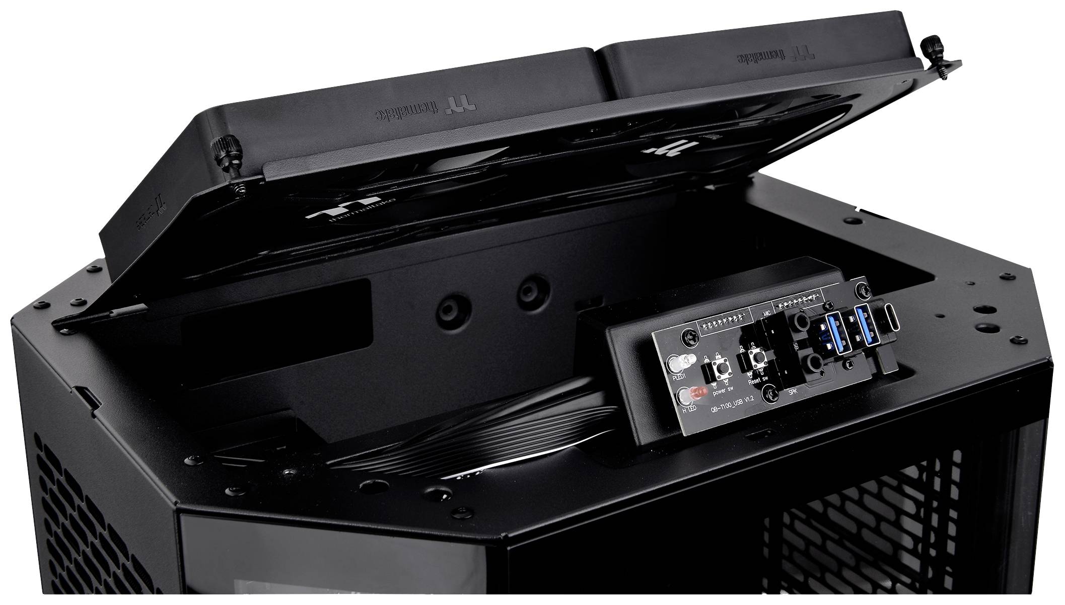 An open computer case lid with a visible connection panel, featuring USB ports and audio connections underneath. Ideal for easy access.