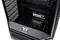PC case by Thermaltake with an open interior, revealing the drive bay and ventilation grille.