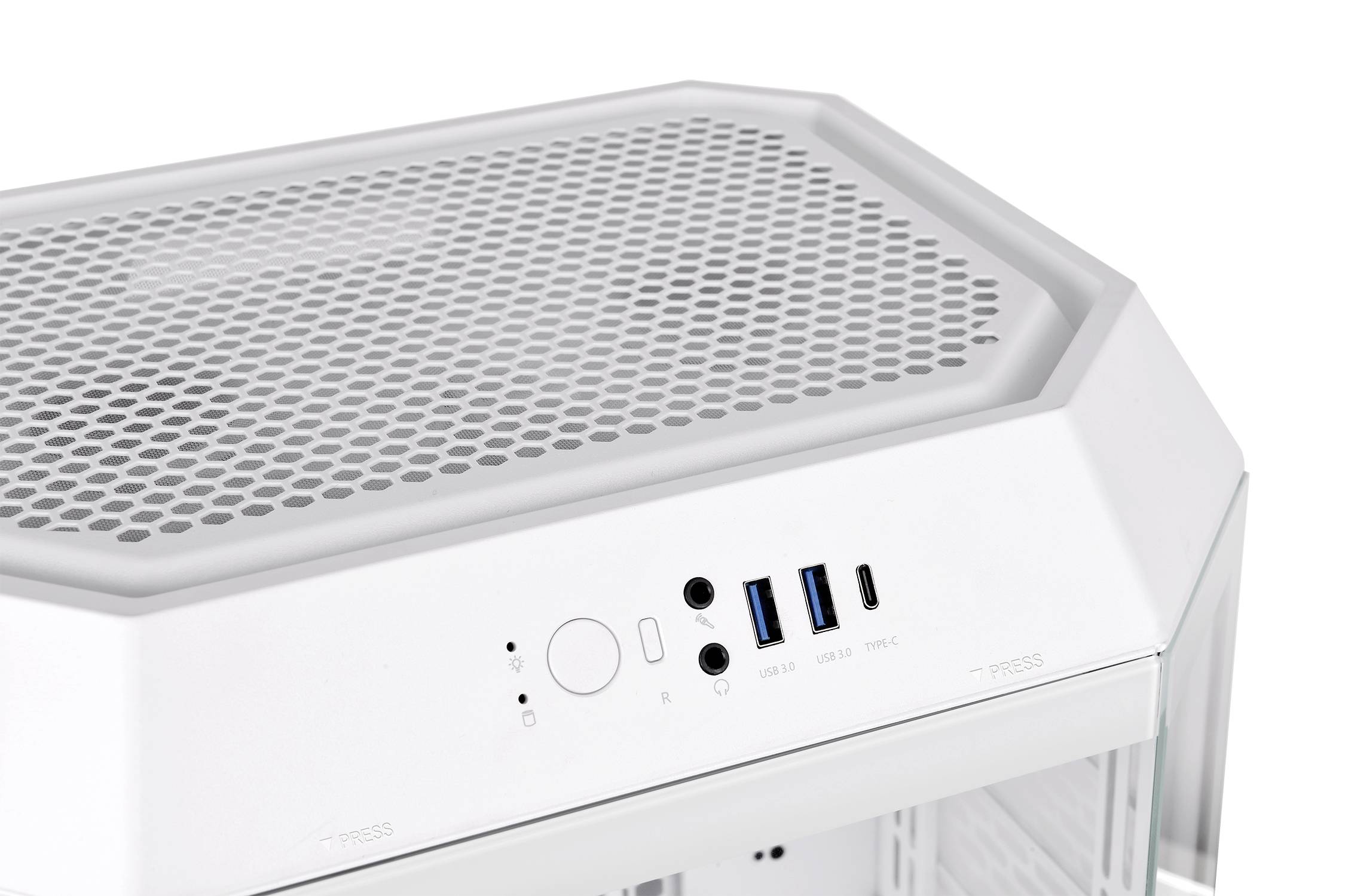 A white computer case with a hexagonal pattern grid on the top surface, with connections and a power button located underneath.