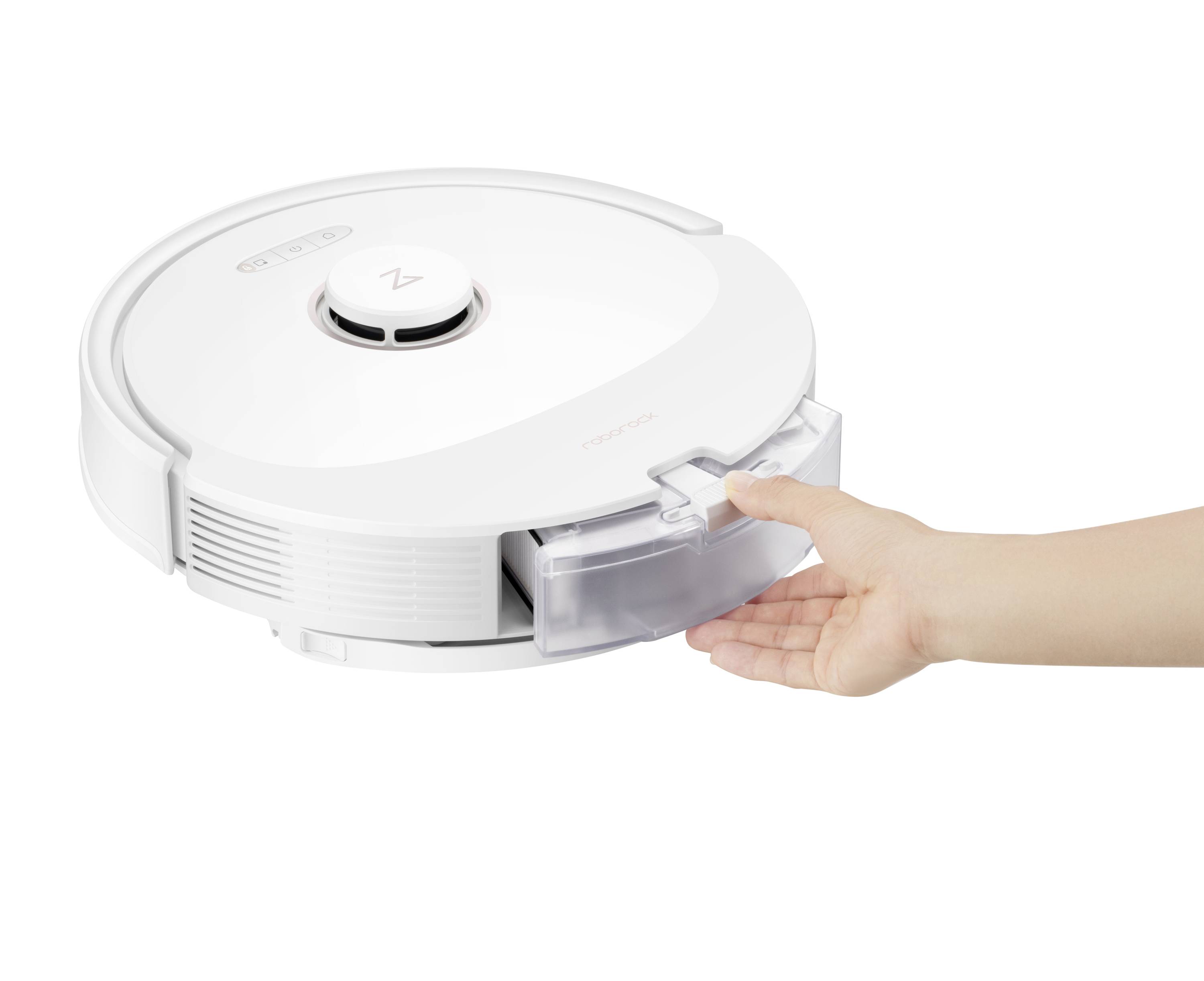 A hand opens the compartment of a white robot vacuum cleaner to remove the dust container. The robot is standing on a white surface.