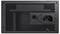 Back of a computer power supply with ventilation grille, power on/off switch, and power connection.