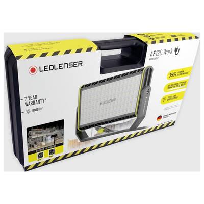 Portable LED work light in box with 35% increased brightness and 7-year warranty. Shown: Product image and construction site photo.