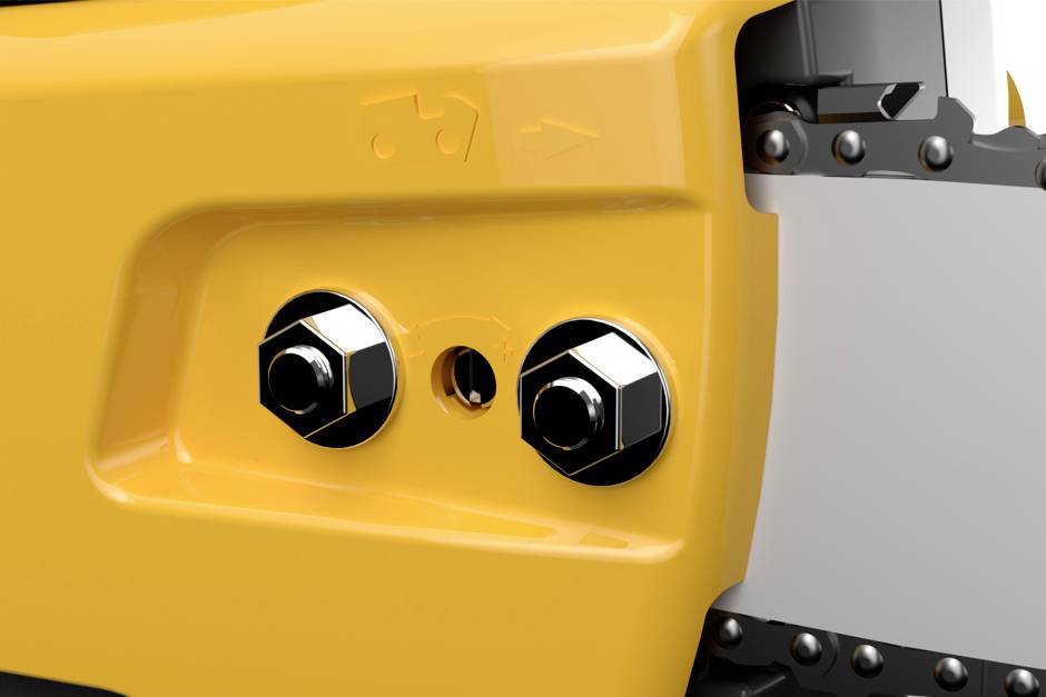 Two gleaming hexagonal bolts on a yellow metal surface, next to a small central hole, part of a mechanical component.