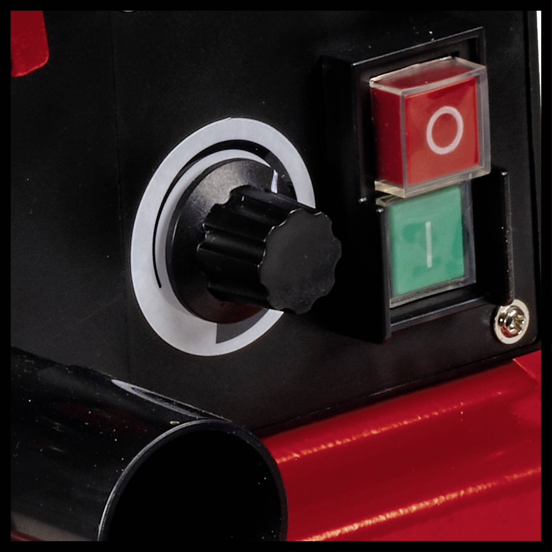 Close-up of an equipment switch with a rotary knob and two buttons, red and green, marked with 'O' and 'I' for Off and On.