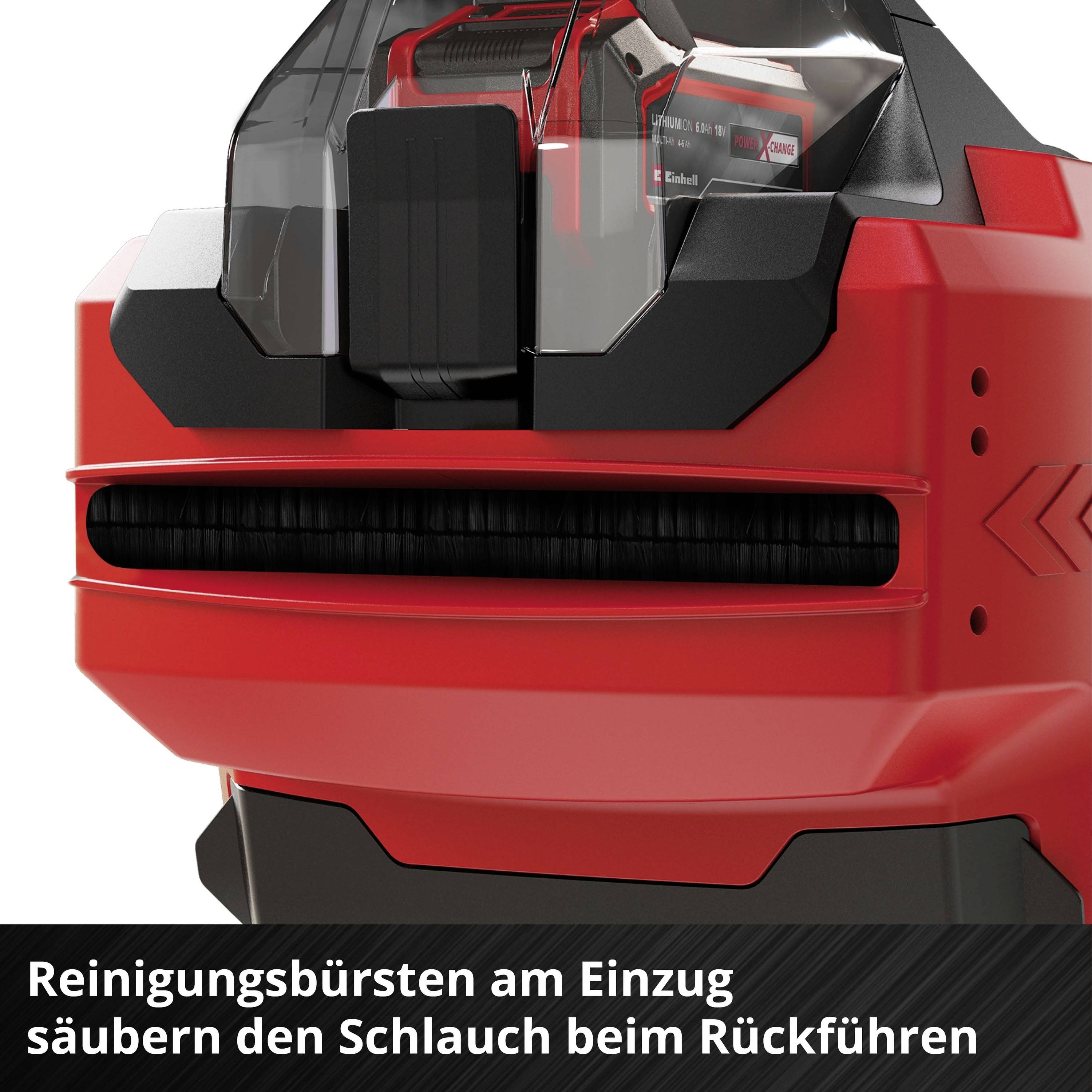 A red device with black cleaning brushes at the intake cleans a hose during retraction.