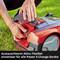A person is changing the battery of a lawnmower on a lawn. Caption: 'Interchangeable battery: Flexibly usable across all Power X-Change devices'.