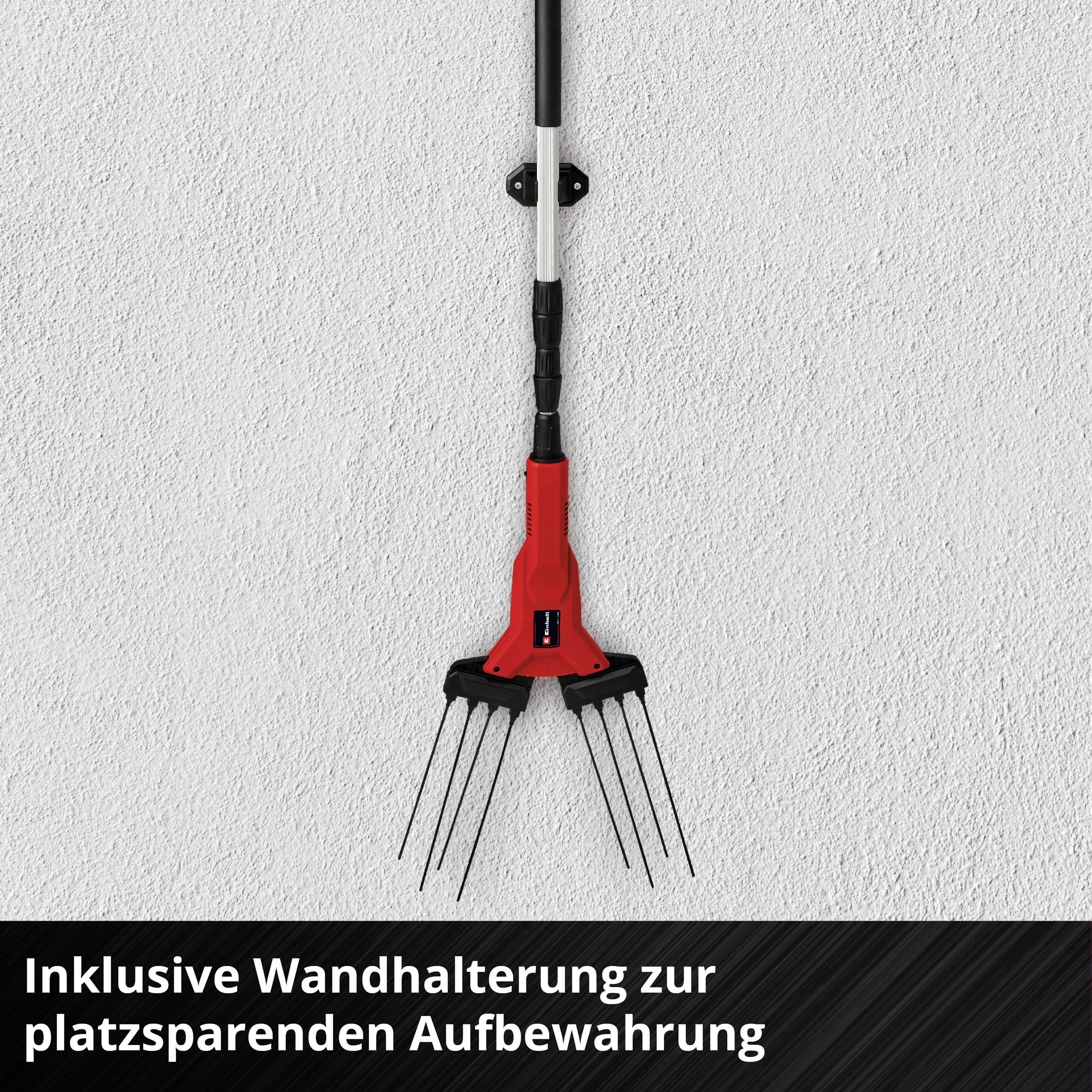 A red garden rake with five prongs hangs on a wall bracket. Underneath it reads: 'Includes wall bracket for space-saving storage'.