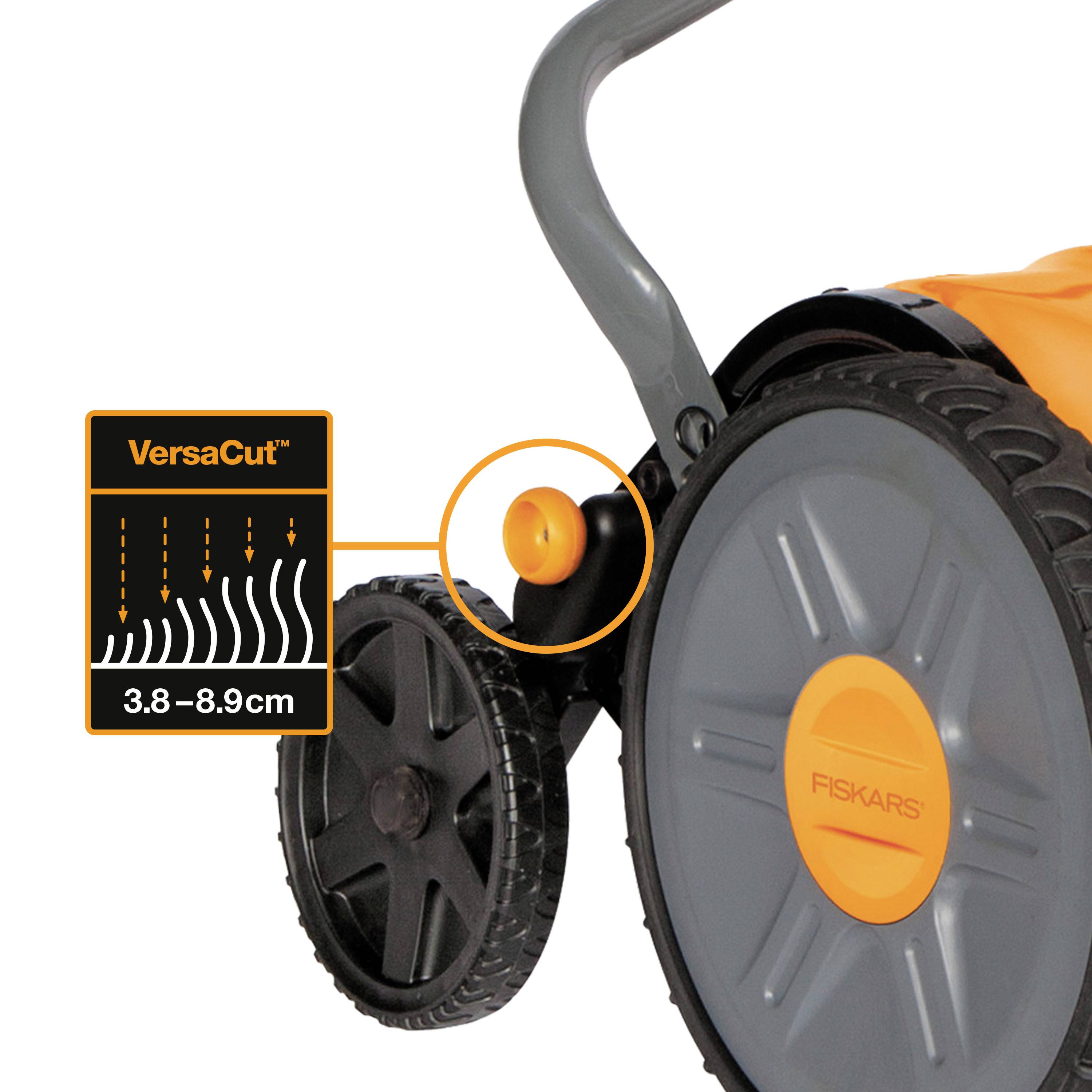 Close-up of a lawnmower with an orange handle; focus on the 'VersaCut' adjustment measuring 1.5-3.5 inches for cutting height.