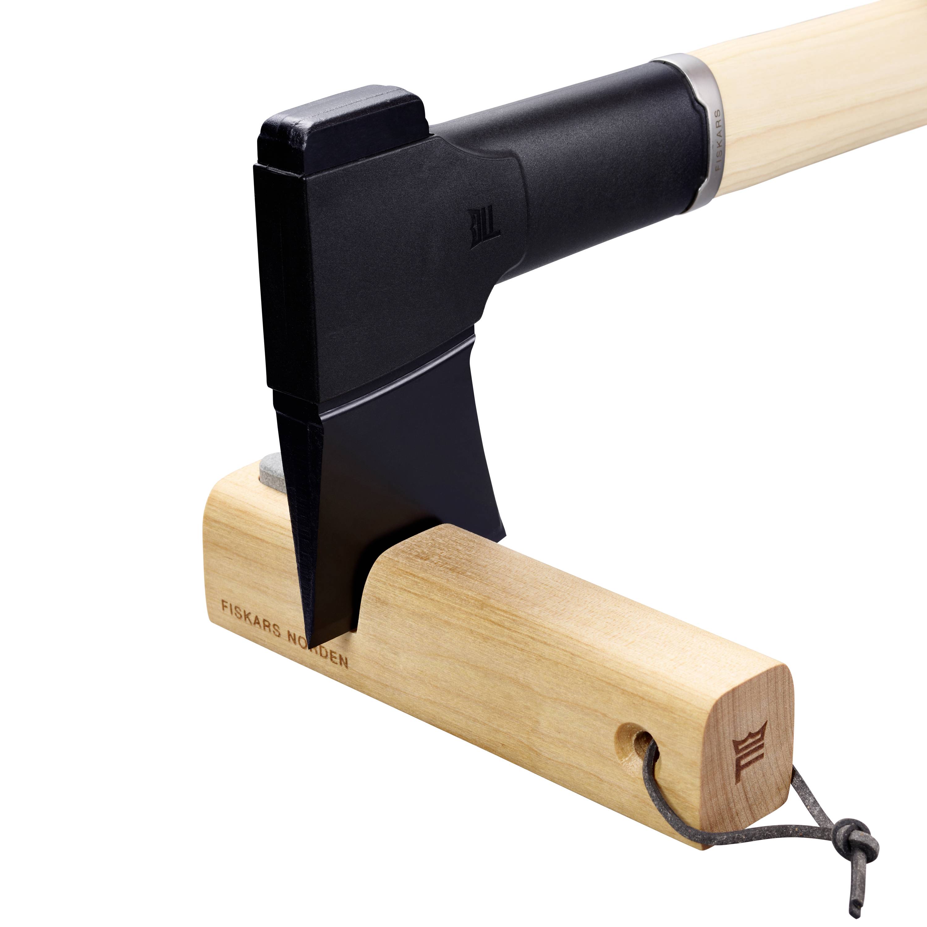 An axe with a black head and a light wooden handle. The blade is embedded in the wooden block. Marked with 'Fiskars Norden'.