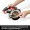 A hand adjusts the spindle lock on a circular saw to allow easy and quick blade changing.