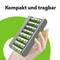 Hand holding a compact, portable battery charger with eight AA batteries. Text at the top: 'Compact and Portable'. Green background.