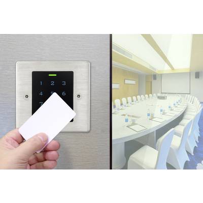A person holds a card up to an electronic door lock outside an empty conference room, symbolising access control.